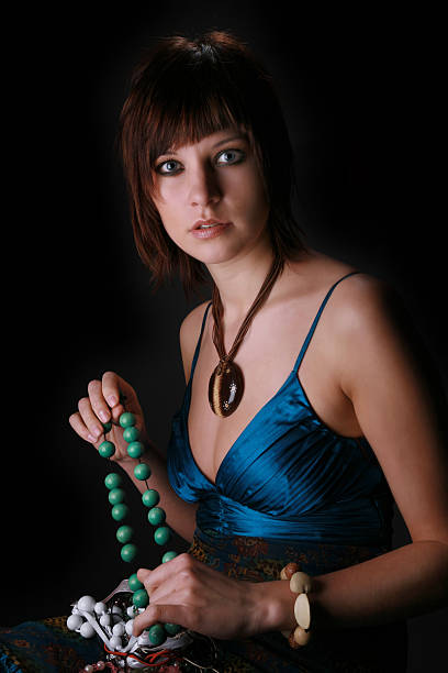 Young woman is choosing jewellery stock photo