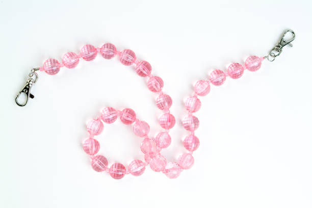 istock pink necklace on white background isolated 1402750358