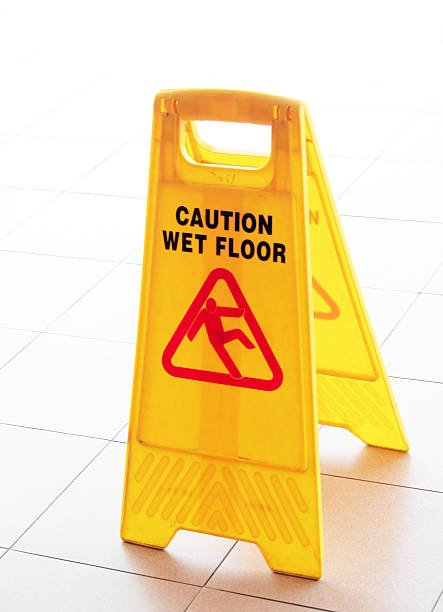 istock A plastic yellow barrier warning people of a wet floor 140275146