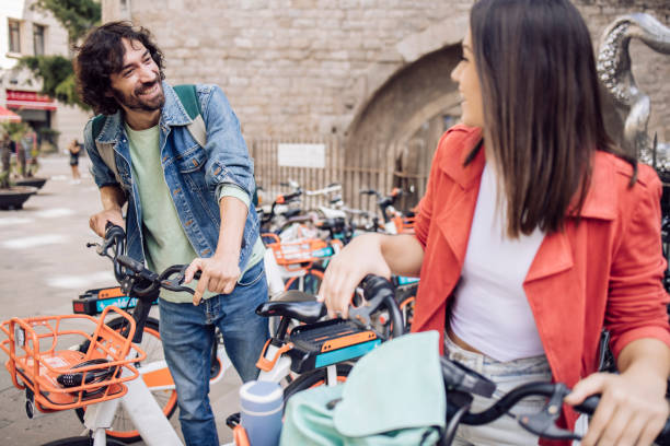 istock Young couple on a journey using a mobile app for renting E-bikes 1402753974