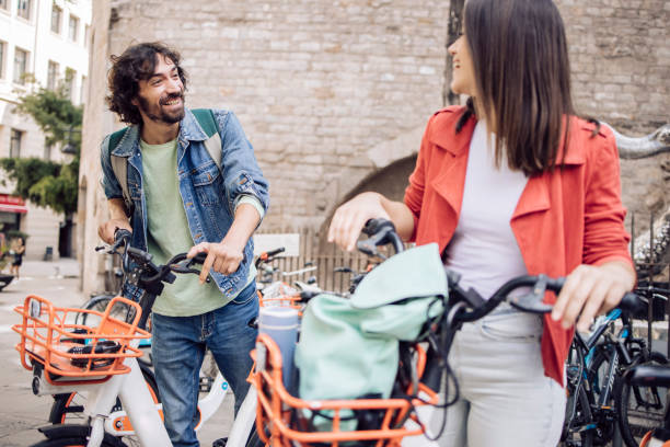 istock Young couple on a journey using a mobile app for renting E-bikes 1402753981