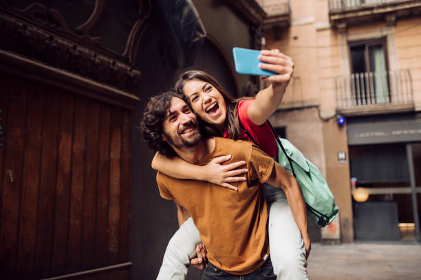 istock Couple taking a selfie and having fun on their vacation 1402754010