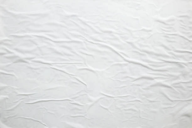 istock white crumpled and creased paper poster texture background 1402754028