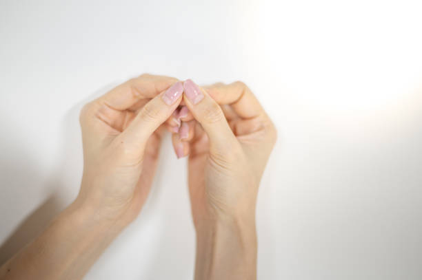 woman's red nail hand
