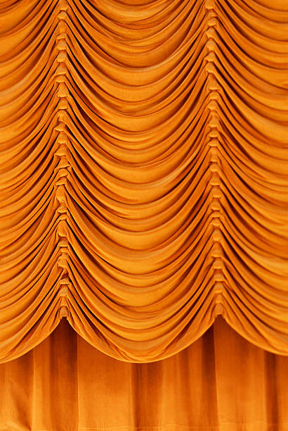 Golden Curtains on Stage A gold backdrop at a local theatre. neck ruff stock pictures, royalty-free photos & images