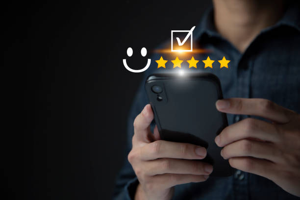 istock Satisfaction and customer service survey concept, business people using  smartphone. to answer the questionnaire And the satisfaction rating, the satisfaction rating with the smiley face icon 5 stars. 1402758307