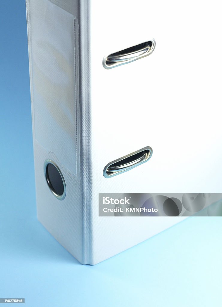 File folder various ofice supplies - white file folder isolated on blue background Archives Stock Photo