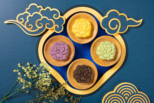 colorful flower shape snowy mooncakes with Chinese decorations