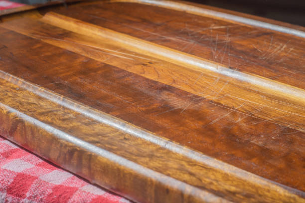 istock Empty wooden tablet with soft light and red cloth underneath 1402764481