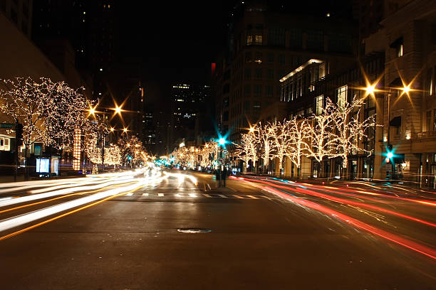 istock Chicago street lit up at night time with lights in trees 140276483