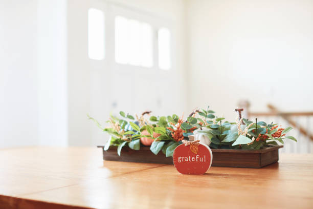 Bright modern dining room with a Thanksgiving centerpiece and GRATEFUL message