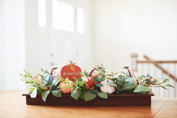 istock Bright modern dining room with a Thanksgiving centerpiece and GRATEFUL message 1402765159