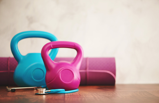 Healthy lifestyle background with kettlebell weights and yoga mat