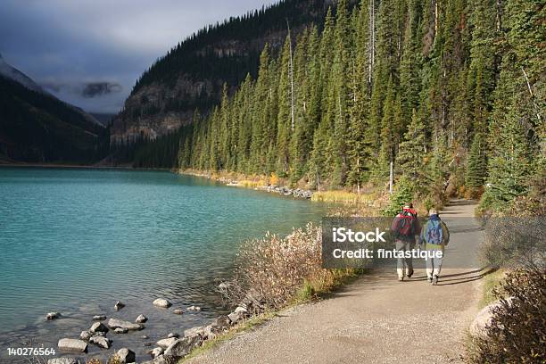 Elderly Couple Walking Stock Photo - Download Image Now - Hiking, Canada, Senior Couple