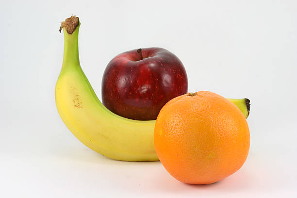 banane apfel und orange & - three objects three people three animals apple stock-fotos und bilder