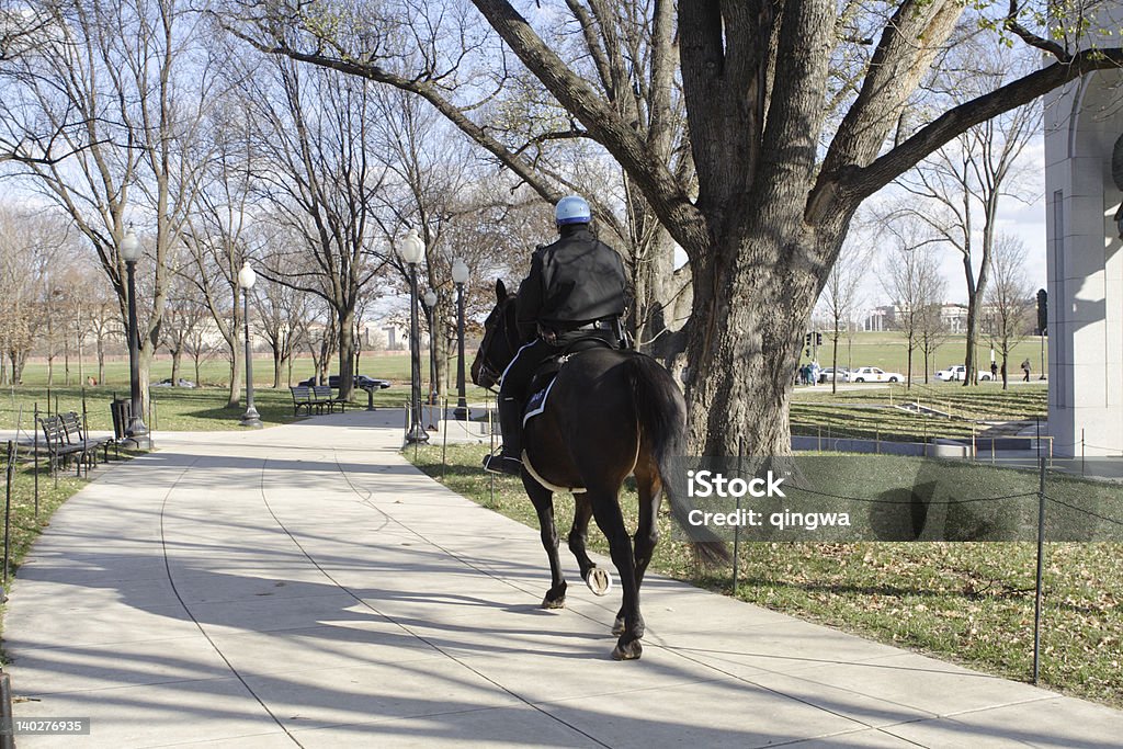 Mounted Police Police officer on horseback, next to the WWII memorial on the national mall in Washington, DC - See lightbox for more Horse Stock Photo