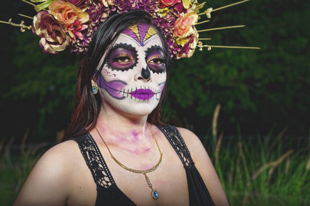 istock Young woman with sugar skull makeup. 1402770249