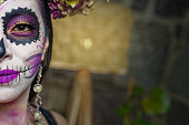 Young woman with sugar skull makeup.