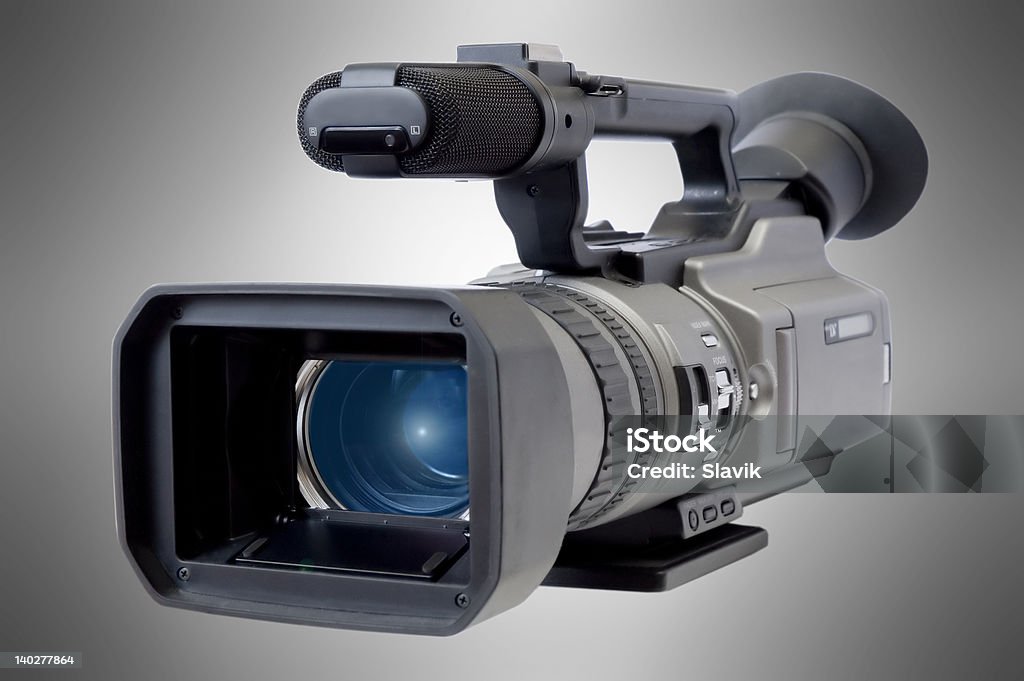 Videocamera Videocamera on a luminous background Black Color Stock Photo