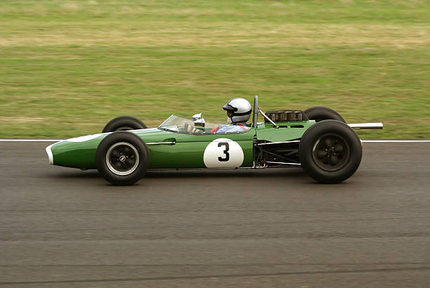 Classic Race Car Classic Brabham Climax BT11 racing car, pictured at Goodwood Revival 2006. racecar photos stock pictures, royalty-free photos & images