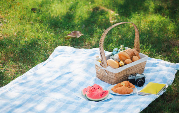 istock Picnic wattled basket with bread food and fruit 1402779271