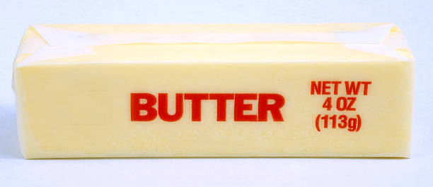 wrapped stick of butter stock photo