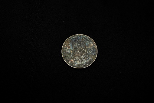 Coins on black background