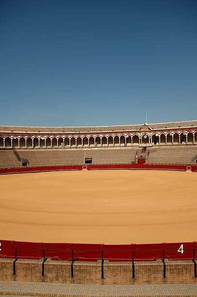 Audience at the Plaza de Toros de la Real Maestranza in Seville, Spain, seen through the opened Prince's Gate.