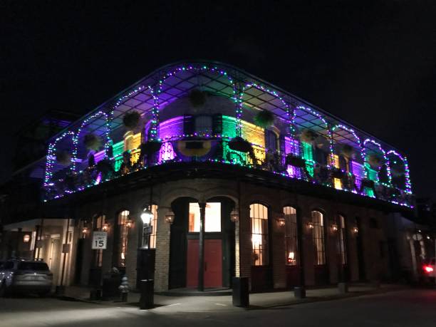 a traditional building decorated with mardi gras colors at night in new orleans, louisiana, usa united states of america. - rio carnival fotos imagens e fotografias de stock