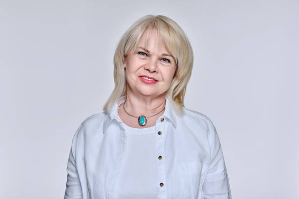 Portrait of senior woman with hairstyle make-up looking at camera stock photo