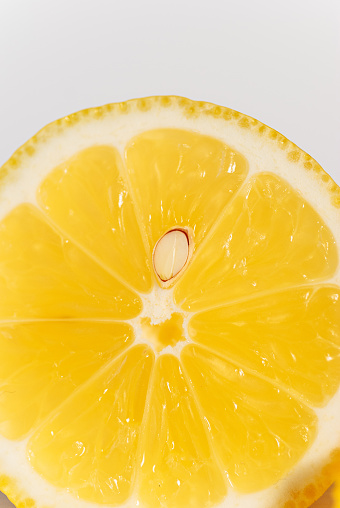 Close-Up Of Lemon Slice Against White Background - stock photo