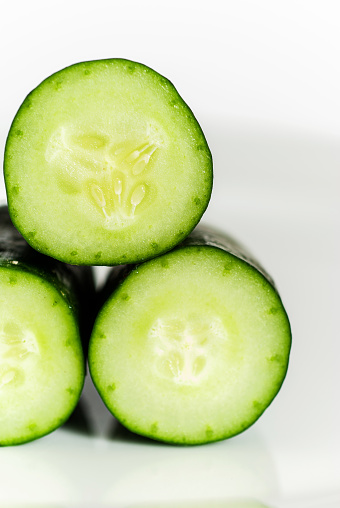 Close-Up Of Cucumbers Over White Background - stock photo