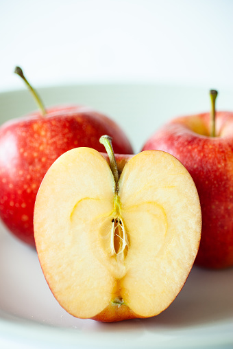 Close up of half of apple, studio shot - stock photo