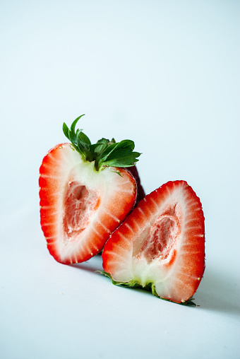Close-Up Of Strawberry Slice Over White Background - stock photo