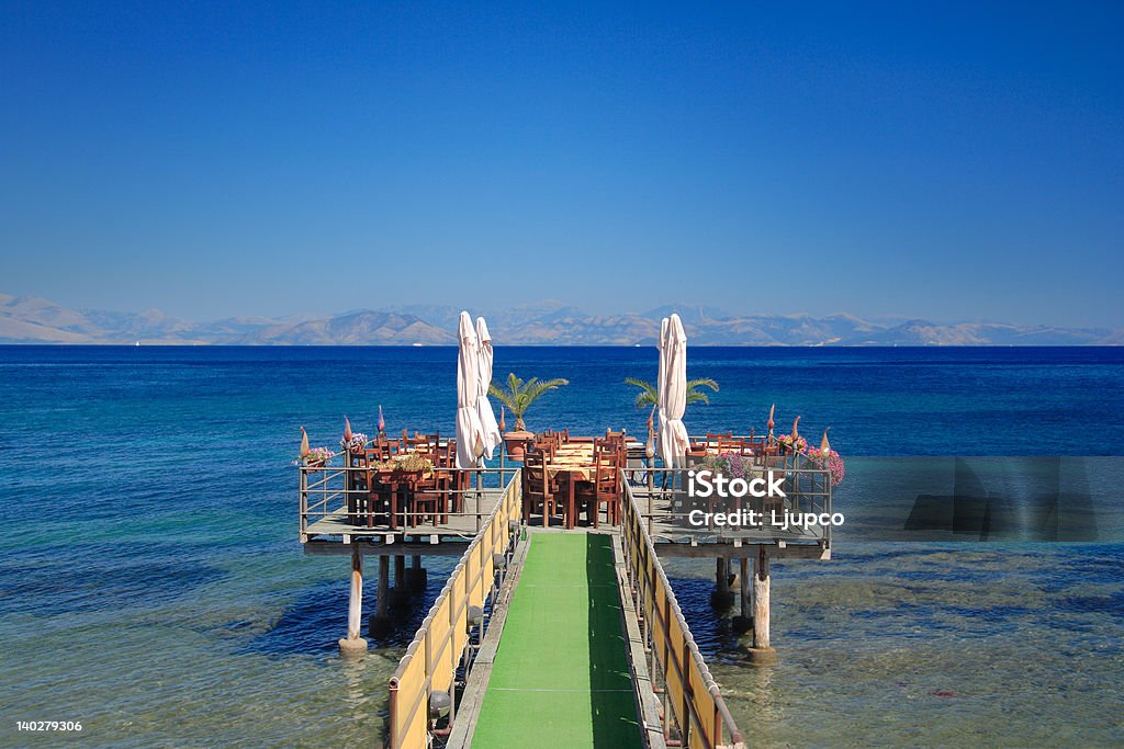 Café at open sea CafA at open sea, Corfu island Greece Bay of Water Stock Photo