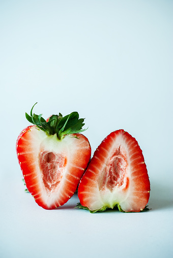 Close-Up Of Strawberry Slice Over White Background - stock photo
