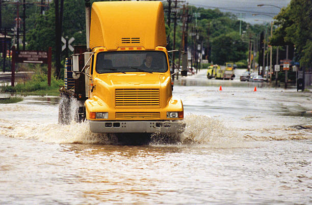 Yellow truck in flooded street