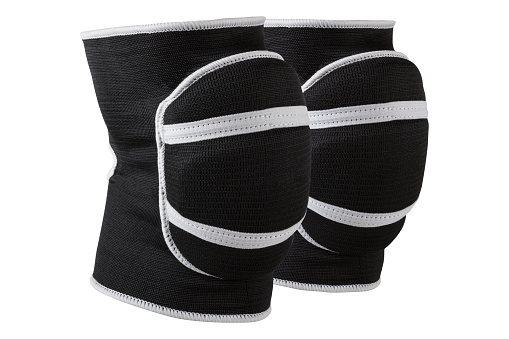 a pair of voluminous black knee pads, for sports games or for dancing, with shock-absorbing pillows, on a white background, isolate