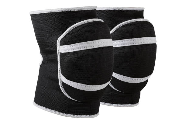 a pair of voluminous black knee pads, for sports games or for dancing, with shock-absorbing pillows a pair of voluminous black knee pads, for sports games or for dancing, with shock-absorbing pillows, on a white background, isolate kneepad stock pictures, royalty-free photos & images