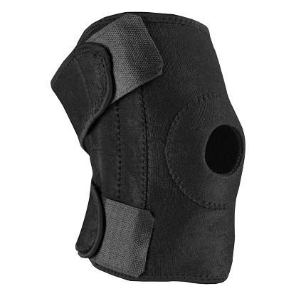 voluminous sports or medical knee pad, with a fixator, to support the knee joint, with Velcro fasteners, on a white background, isolate
