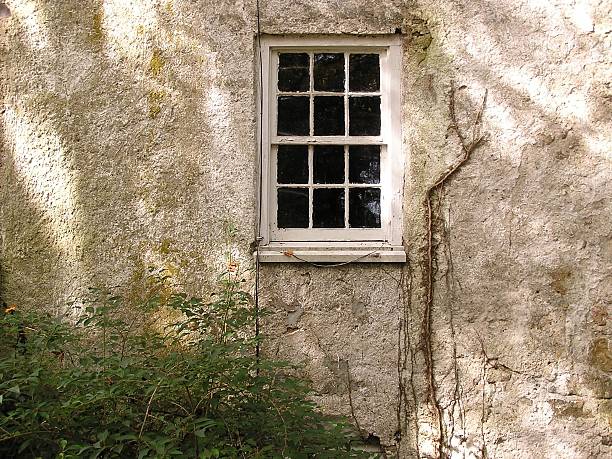 Colonial American Farmhouse Wall & Window with Sunlight stock photo