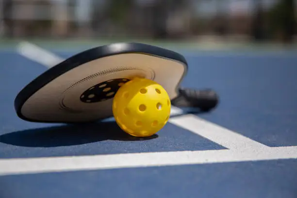 Photo of Boy playing pickle ball