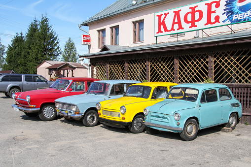 Yaroslavl Region, Russia - August 26, 2011: Bright classic cars near a cafe at a roadside.