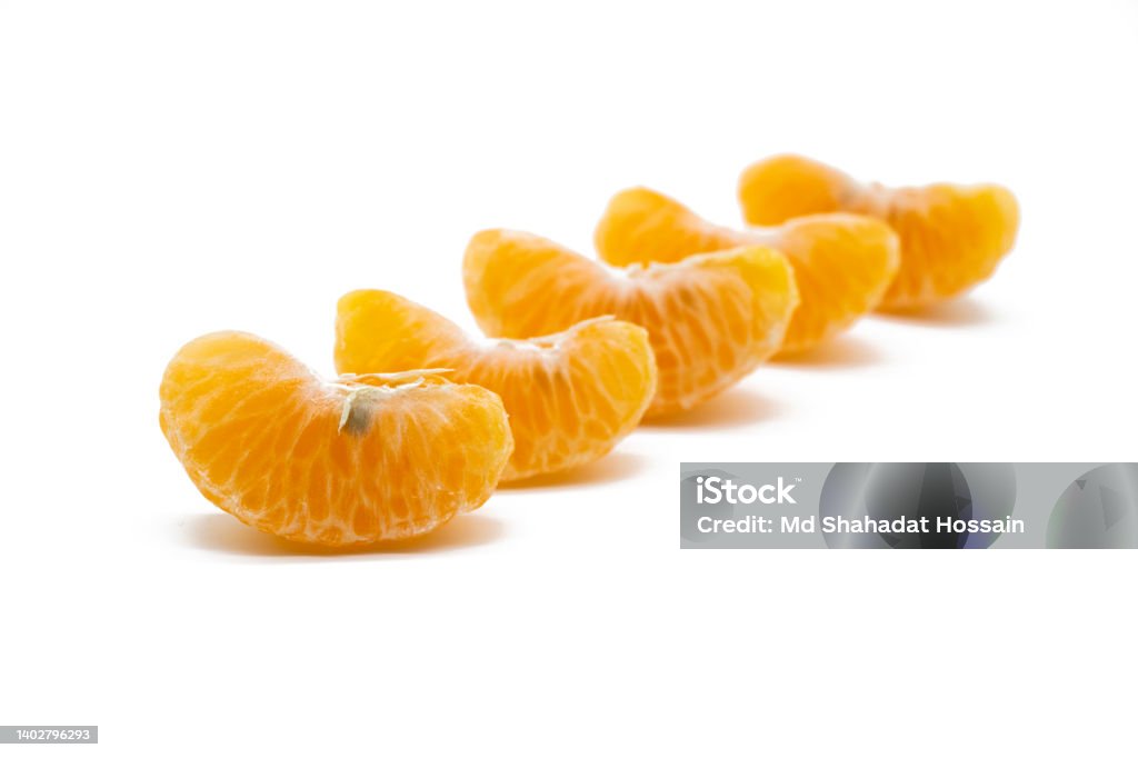 some slices of tangerine isolated on white background. Bangladesh Stock Photo