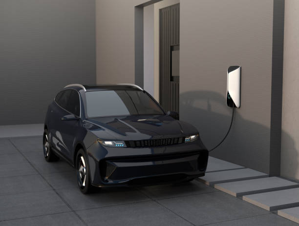 istock Black electric SUV charing at home garage 1402797180