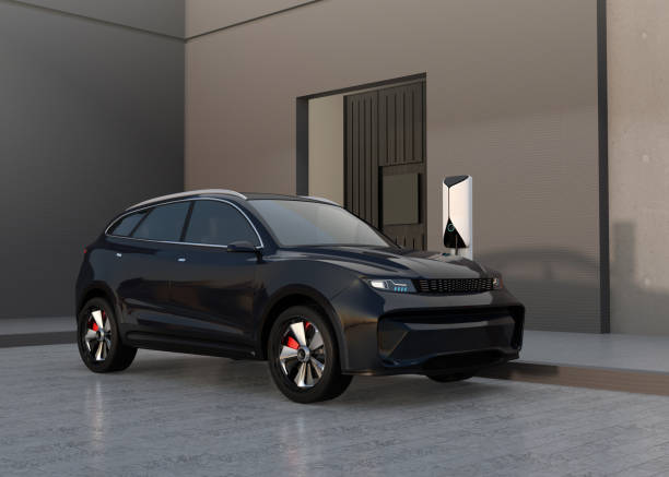 istock Black electric SUV charing at home garage 1402797185