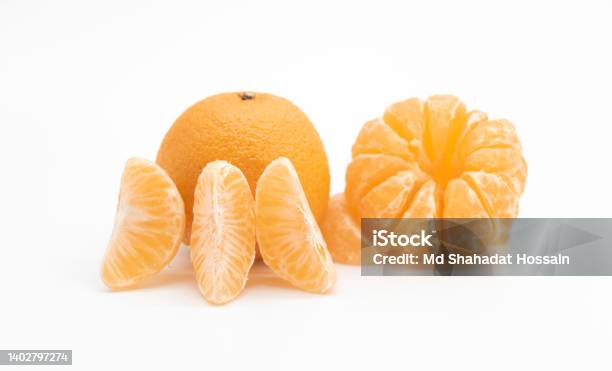 Tangerine Or Kamala With Pieces Over On White Background Stock Photo - Download Image Now