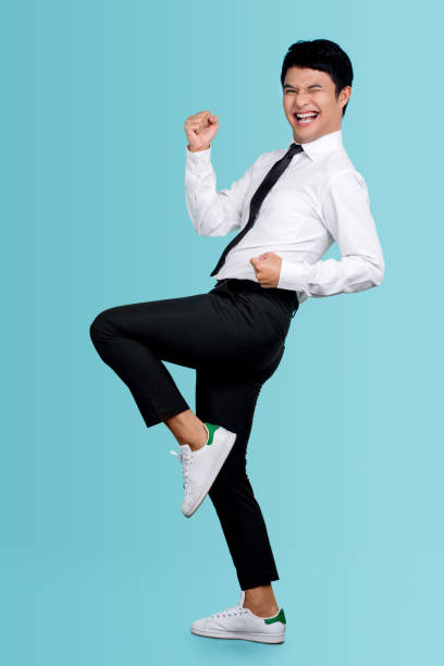 istock Full length body size view of attractive successful cheerful guy dancing having fun celebrating victory isolated over blue pastel color background 1402798015