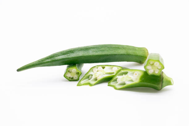 whole and slices okra or Lady Finger over on white background,vegetable concept stock photo