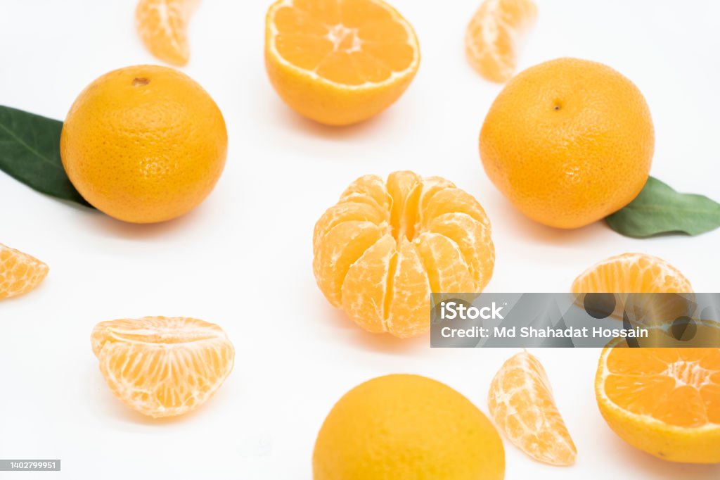 whole and slice Tangerine or kamala in a plate isolated on white background, view from top Bangladesh Stock Photo